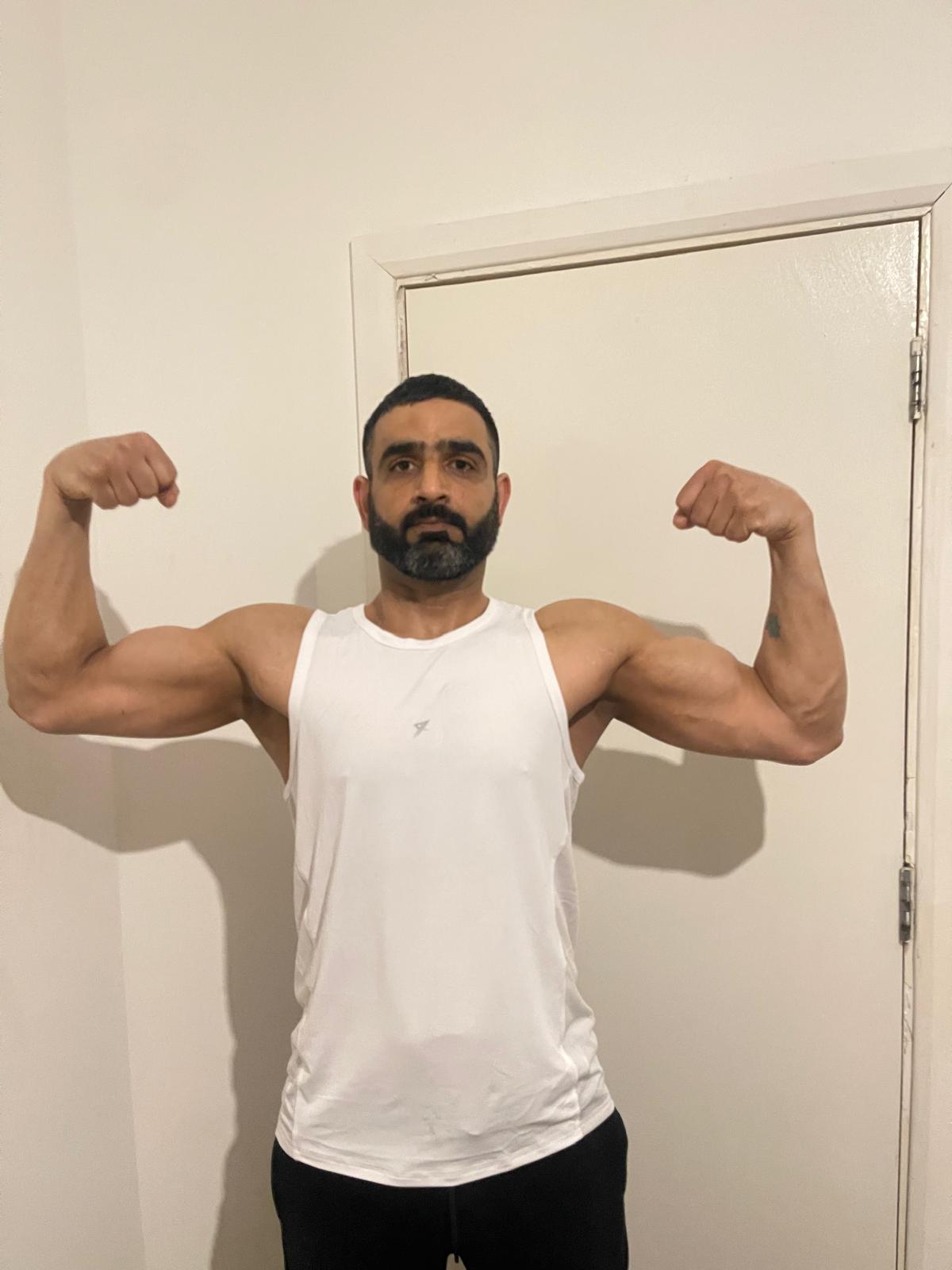 Naveed wearing training vest